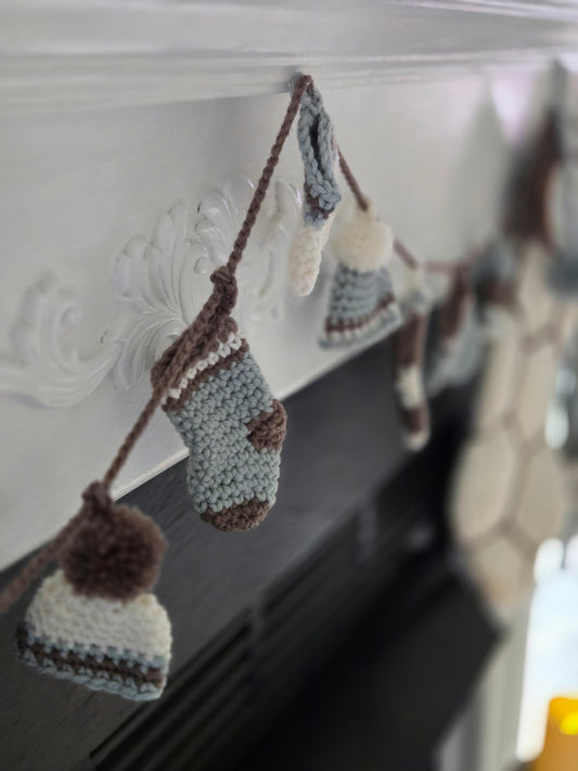 Woodland Calm Crochet Christmas Garland with Mittens, Hats, and Stockings in Soft Green, Cream, and Bark